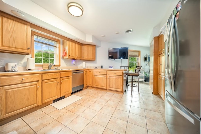 1441 Stafford Rd, Fall River, MA 02721 - kitchen featuring stainless steel appliances, a sink, light tile patterned floors, a peninsula, and light countertops