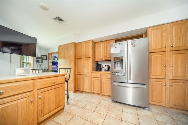 1441 Stafford Rd, Fall River, MA 02721 - kitchen with stainless steel fridge with ice dispenser, light tile patterned floors, and light countertops