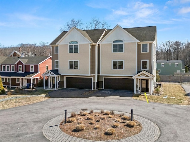 view of front of house with aphalt driveway and a garage