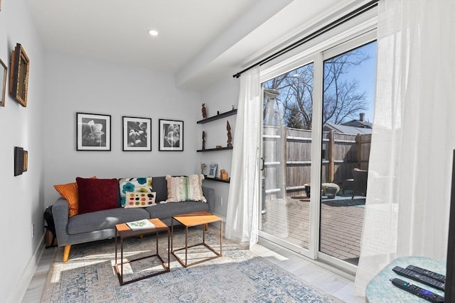 sitting room featuring recessed lighting, baseboards, and wood finished floors