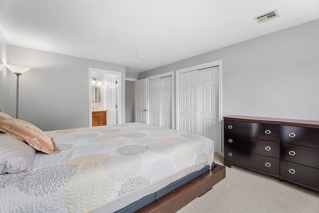 18 Hitching Post Ln Unit 18, Northborough, MA 01532 - bedroom with multiple closets, light colored carpet, and ensuite bath