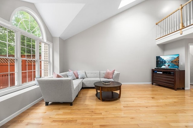 18 Hitching Post Ln Unit 18, Northborough, MA 01532 - living area featuring light wood-style floors, a skylight, and high vaulted ceiling