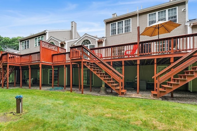 18 Hitching Post Ln Unit 18, Northborough, MA 01532 - rear view of property featuring stairway, a wooden deck, and a yard