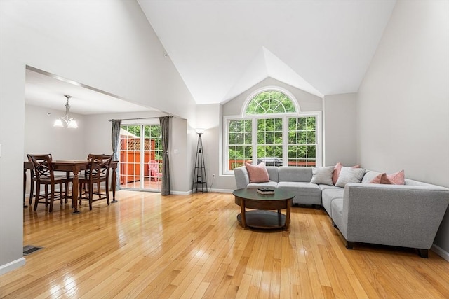 18 Hitching Post Ln Unit 18, Northborough, MA 01532 - living area with light wood-style flooring, healthy amount of natural light, a chandelier, and lofted ceiling