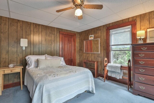 32 Carter St, Hudson, MA 01749 - bedroom with carpet flooring, wood walls, a paneled ceiling, and a ceiling fan