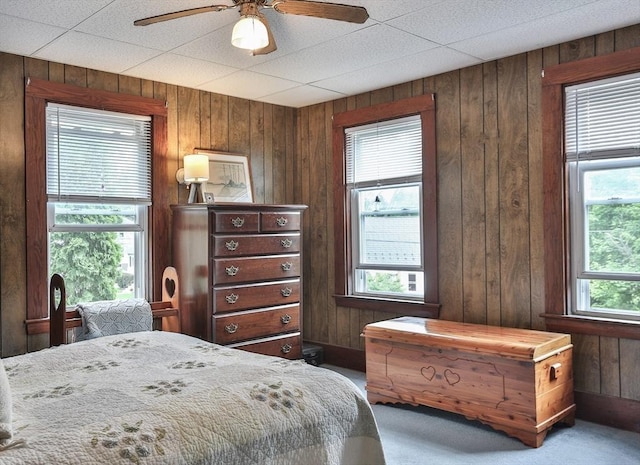 32 Carter St, Hudson, MA 01749 - carpeted bedroom featuring wooden walls and a ceiling fan