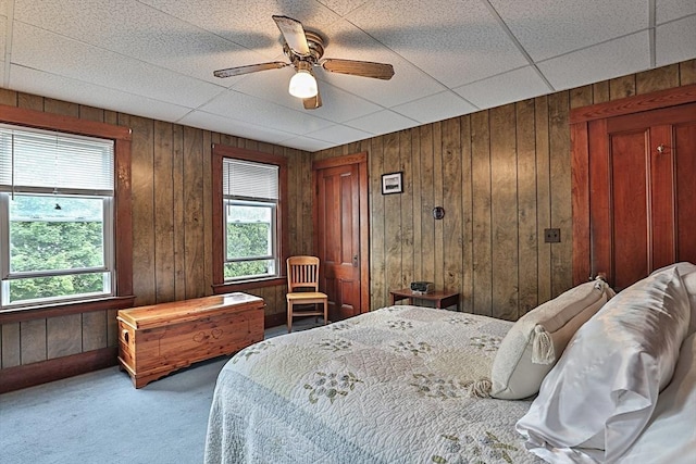 32 Carter St, Hudson, MA 01749 - carpeted bedroom featuring wooden walls and a ceiling fan