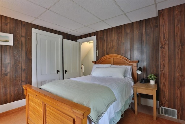 32 Carter St, Hudson, MA 01749 - carpeted bedroom featuring wood walls and a drop ceiling