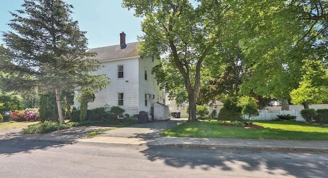 32 Carter St, Hudson, MA 01749 - view of front of property with a chimney and driveway