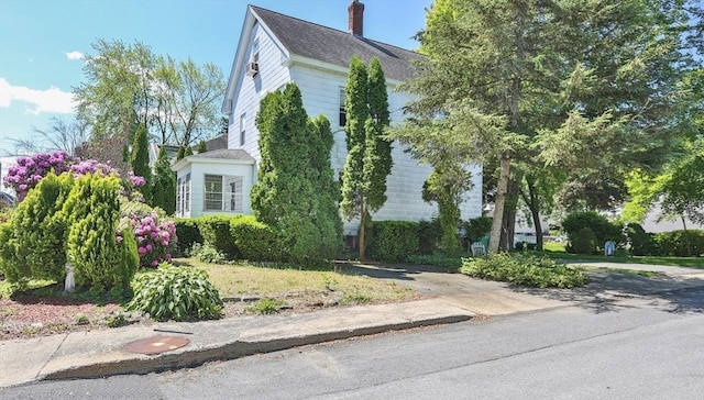 32 Carter St, Hudson, MA 01749 - view of property exterior with a chimney