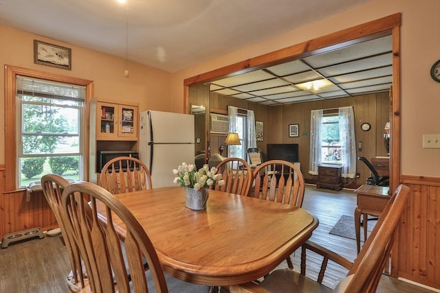 32 Carter St, Hudson, MA 01749 - dining room featuring wood finished floors, wooden walls, and a wainscoted wall
