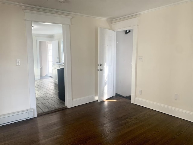 empty room featuring a baseboard heating unit, dark wood-type flooring, and ornamental molding