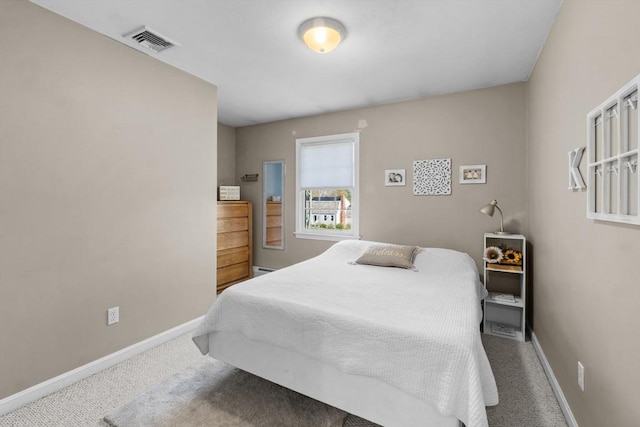 bedroom featuring visible vents, carpet flooring, and baseboards