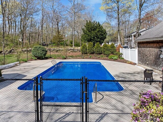 view of pool featuring fence, a gate, and a fenced in pool