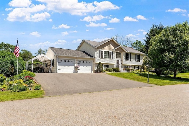 68 Victoria Ave, Athol, MA 01331 - raised ranch featuring an attached garage, a front yard, a carport, and asphalt driveway