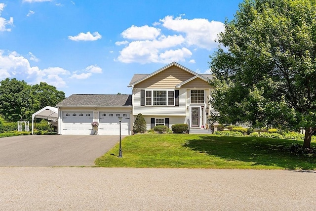 68 Victoria Ave, Athol, MA 01331 - view of front of home featuring an attached garage, a front yard, and asphalt driveway