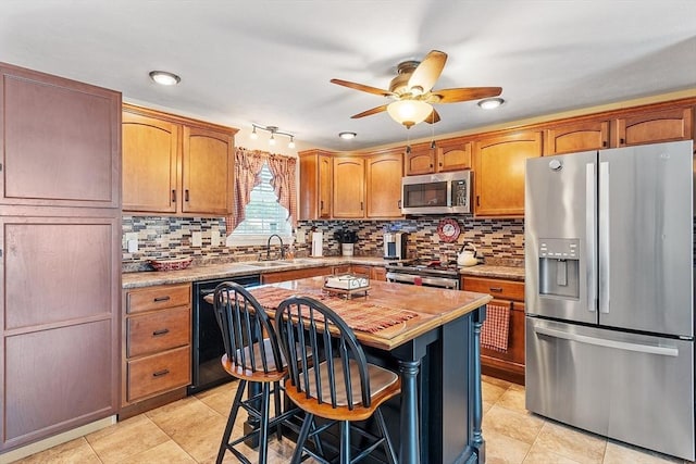 68 Victoria Ave, Athol, MA 01331 - kitchen featuring stainless steel appliances, tasteful backsplash, a ceiling fan, and light countertops
