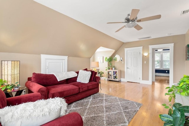 247 Ash St Unit 3, Waltham, MA 02453 - living room with light wood-type flooring, a ceiling fan, a baseboard heating unit, lofted ceiling, and baseboards