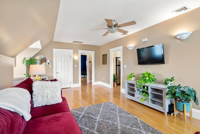 247 Ash St Unit 3, Waltham, MA 02453 - living room featuring wood finished floors, a ceiling fan, and baseboards