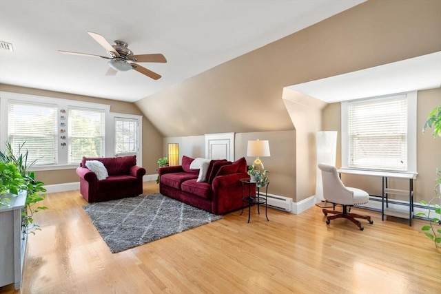 247 Ash St Unit 3, Waltham, MA 02453 - living area featuring a baseboard heating unit, wood finished floors, baseboards, ceiling fan, and lofted ceiling