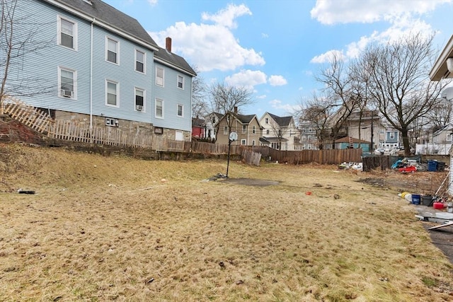 view of yard featuring a residential view and fence