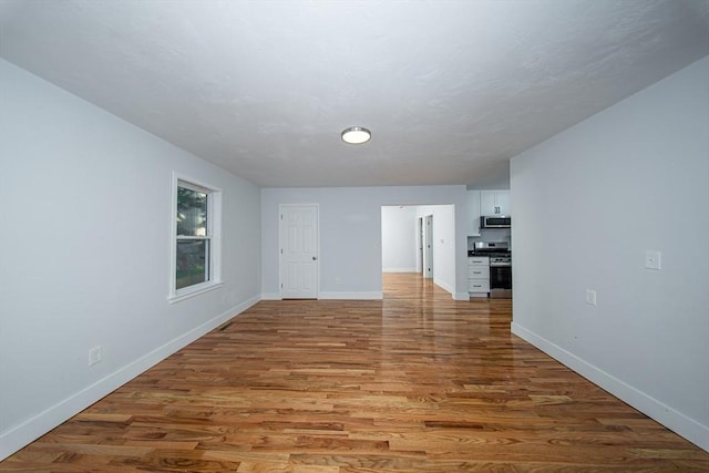 121 Horton St, Fall River, MA 02723 - spare room with baseboards and wood finished floors
