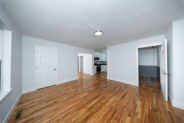 121 Horton St, Fall River, MA 02723 - unfurnished living room featuring light wood-style floors and baseboards