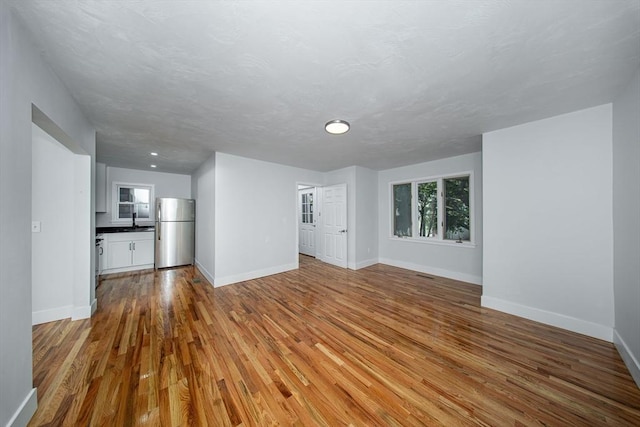 121 Horton St, Fall River, MA 02723 - unfurnished living room with wood finished floors and baseboards