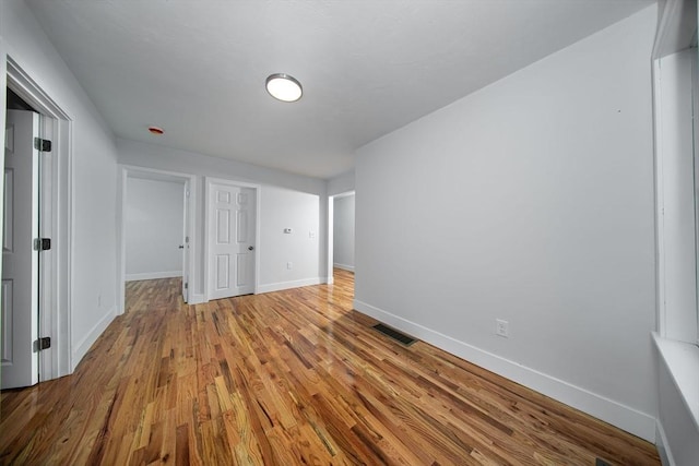 121 Horton St, Fall River, MA 02723 - unfurnished bedroom with baseboards and wood finished floors