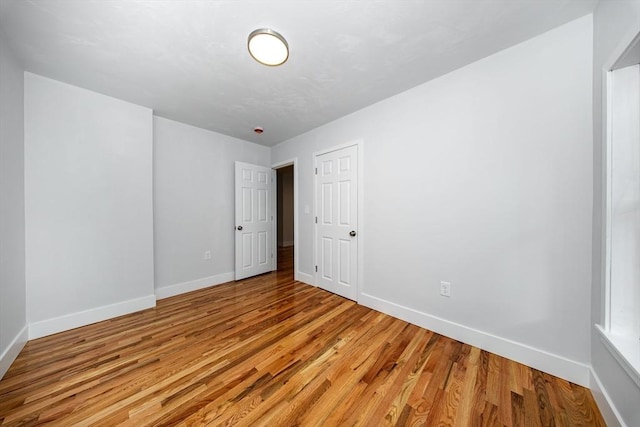 121 Horton St, Fall River, MA 02723 - unfurnished bedroom featuring baseboards and light wood-style floors