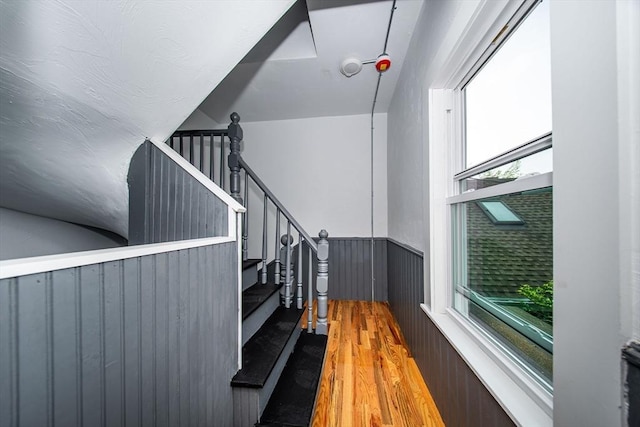 121 Horton St, Fall River, MA 02723 - stairs with a wainscoted wall, wood finished floors, and lofted ceiling