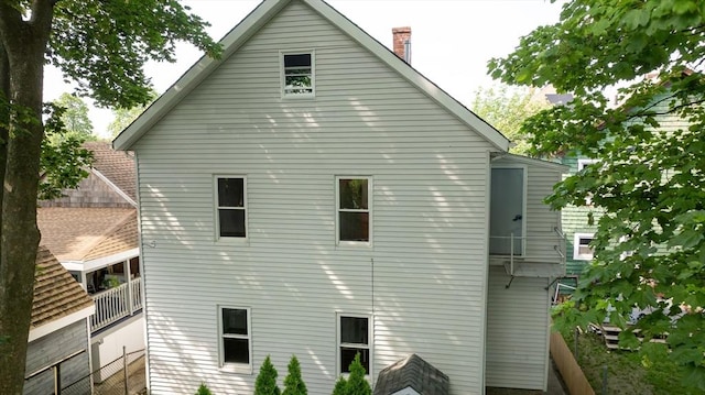 121 Horton St, Fall River, MA 02723 - view of property exterior with a chimney