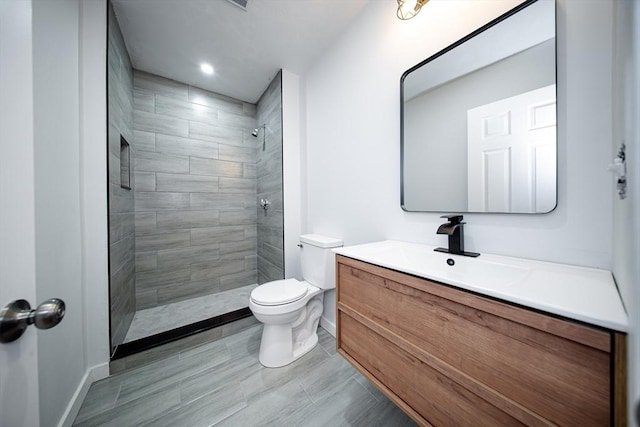 121 Horton St, Fall River, MA 02723 - full bathroom with toilet, vanity, baseboards, and a tile shower