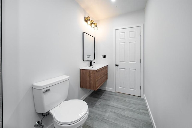 121 Horton St, Fall River, MA 02723 - bathroom with vanity, toilet, and baseboards