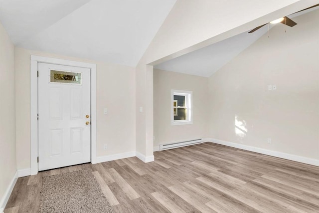 entryway featuring baseboard heating, ceiling fan, lofted ceiling, and light wood-type flooring