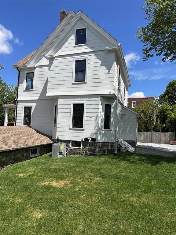 269 Main St, Melrose, MA 02176 - back of property with a chimney and cooling unit