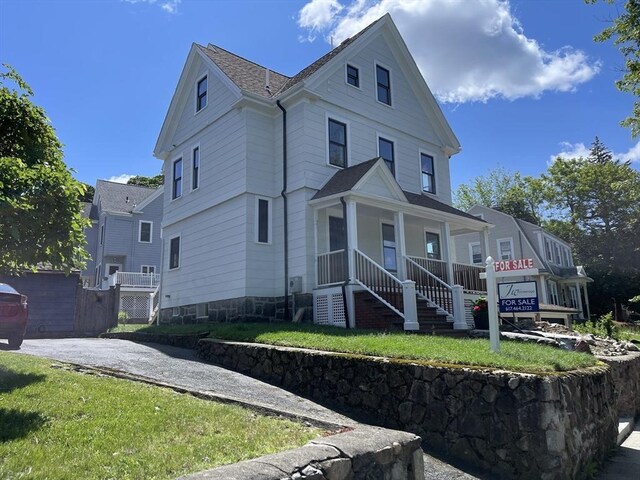 269 Main St, Melrose, MA 02176 - view of front facade featuring covered porch, stairs, and roof with shingles
