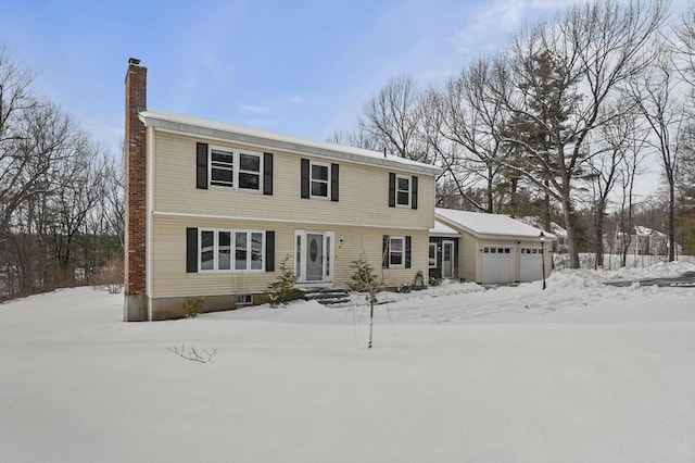 colonial home with a garage