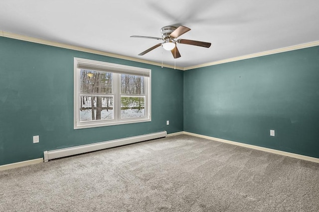 carpeted spare room with ornamental molding, ceiling fan, and baseboard heating