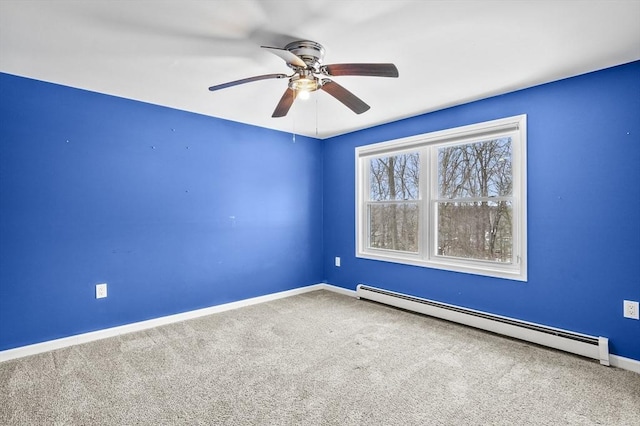 empty room featuring ceiling fan, a baseboard radiator, and carpet floors