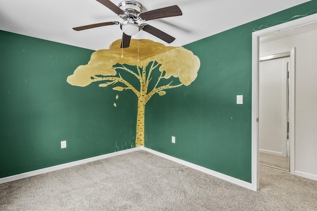 unfurnished room featuring carpet floors and ceiling fan