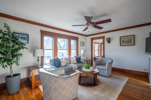 living room featuring ornamental molding, ceiling fan, and hardwood / wood-style floors