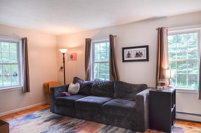 169 Lyman Rd, Berlin, MA 01503 - living room with healthy amount of natural light, baseboard heating, and light wood-type flooring