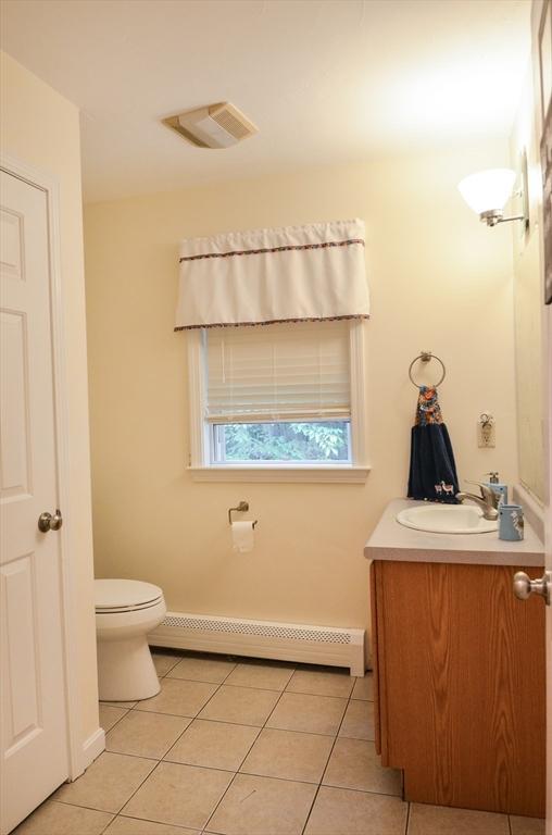 169 Lyman Rd, Berlin, MA 01503 - bathroom featuring tile patterned floors, vanity, and a baseboard heating unit