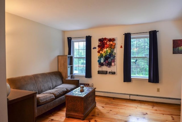 169 Lyman Rd, Berlin, MA 01503 - living area with a baseboard radiator and light wood-style floors