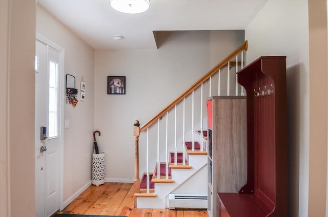 169 Lyman Rd, Berlin, MA 01503 - entryway featuring a baseboard radiator, hardwood / wood-style flooring, and stairs