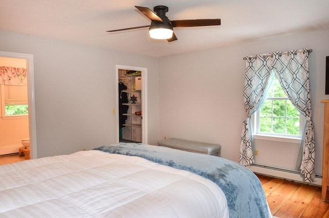 169 Lyman Rd, Berlin, MA 01503 - bedroom featuring a baseboard radiator, light wood-style floors, ensuite bathroom, and ceiling fan