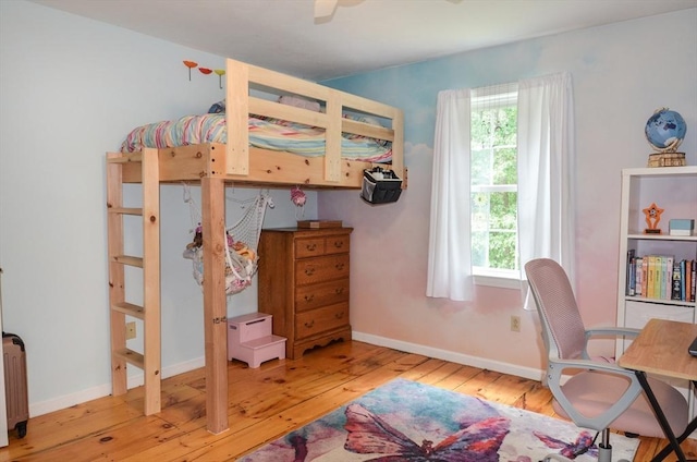 169 Lyman Rd, Berlin, MA 01503 - bedroom featuring hardwood / wood-style floors, multiple windows, a desk, and radiator heating unit