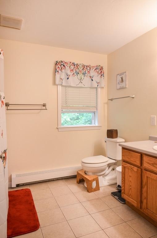 169 Lyman Rd, Berlin, MA 01503 - bathroom featuring a baseboard radiator, tile patterned floors, and vanity