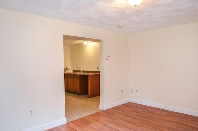 169 Lyman Rd, Berlin, MA 01503 - spare room with light wood finished floors and a smoke detector